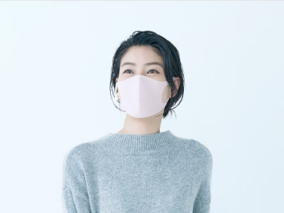 Woman wearing a pink Pitta Mask